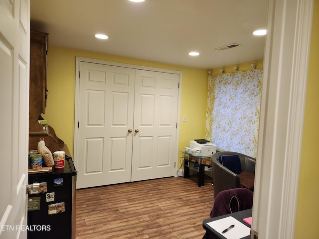 home office featuring recessed lighting, visible vents, and wood finished floors