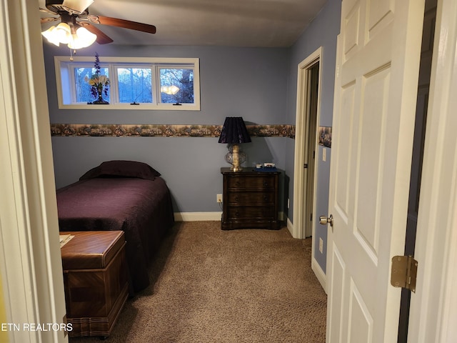 carpeted bedroom featuring baseboards