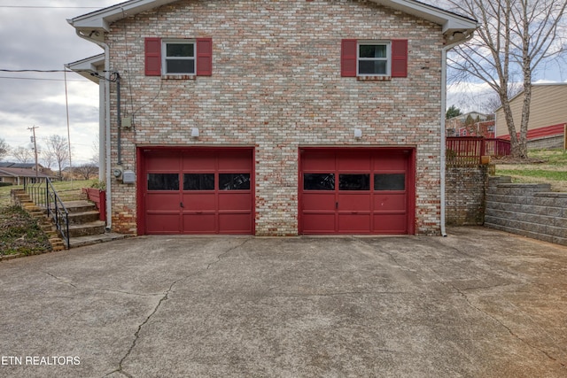 garage featuring driveway