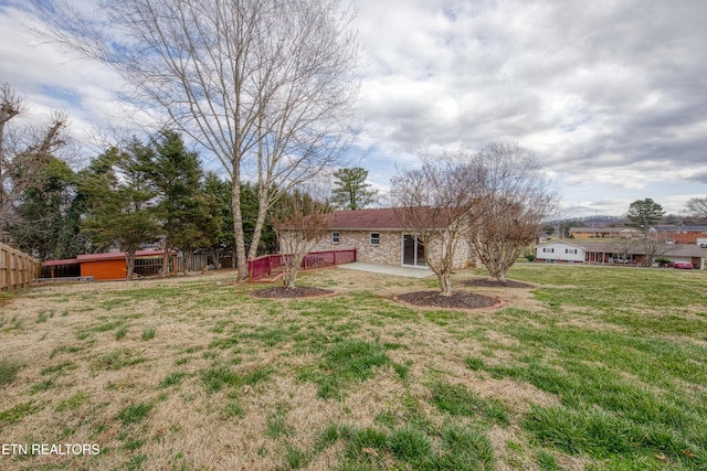 view of yard featuring a patio area and fence