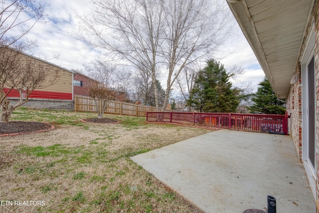 view of yard featuring a patio area and fence