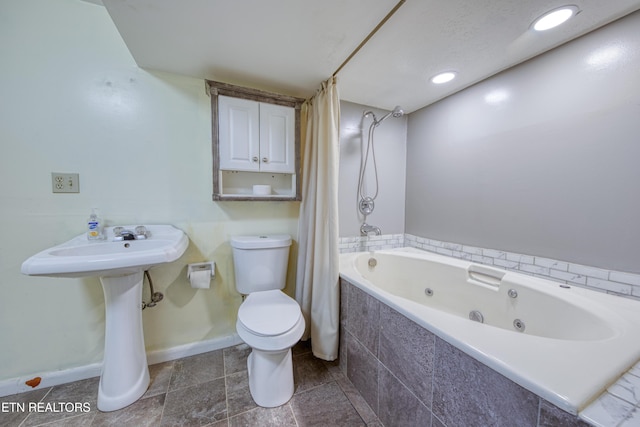 bathroom featuring toilet, a combined bath / shower with jetted tub, baseboards, and recessed lighting