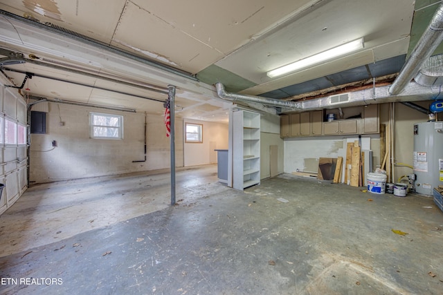 basement with visible vents and gas water heater