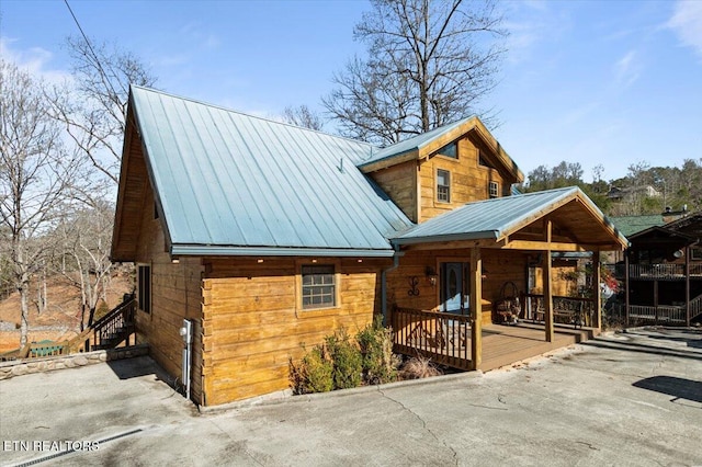 rustic home featuring metal roof