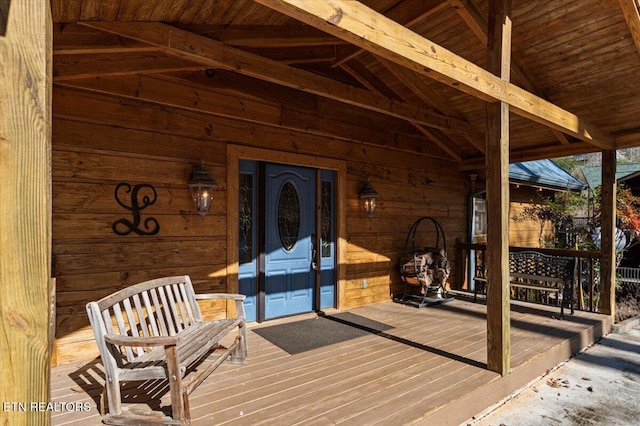 wooden terrace with a porch