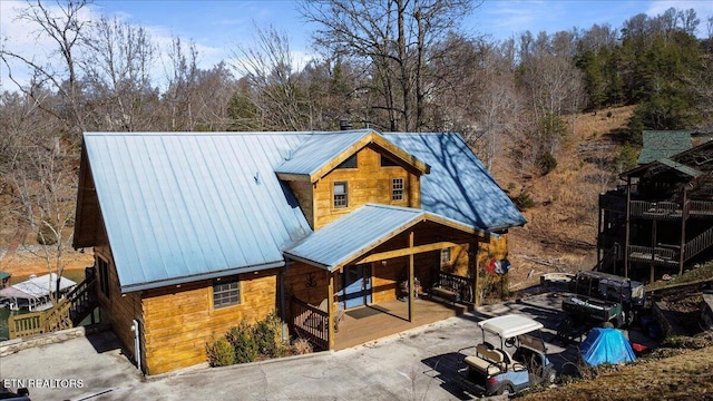 view of front of home featuring a porch and metal roof