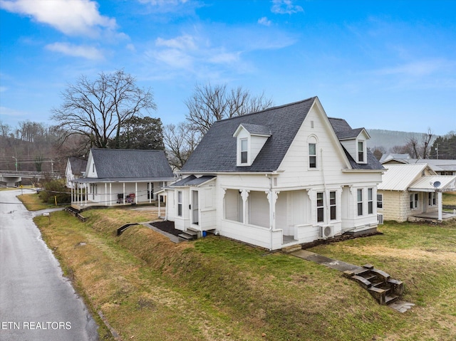 view of front facade featuring a front yard and entry steps