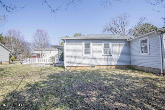 exterior space featuring a yard and fence