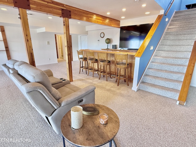 living area featuring carpet floors, recessed lighting, indoor wet bar, and stairs