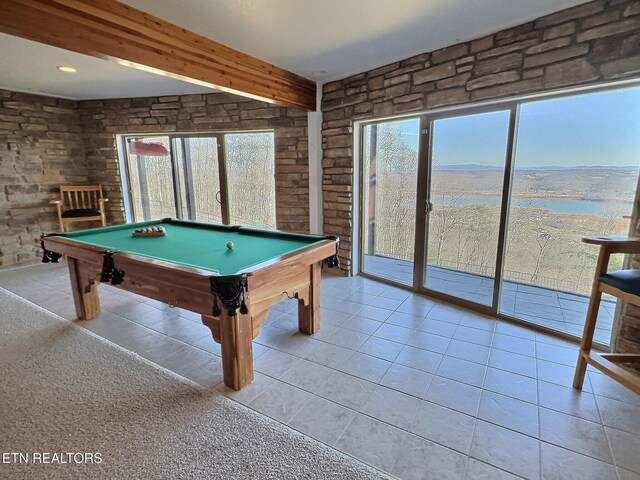 rec room featuring light tile patterned floors, beamed ceiling, and pool table