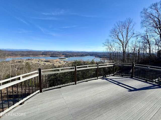 wooden deck featuring a water view