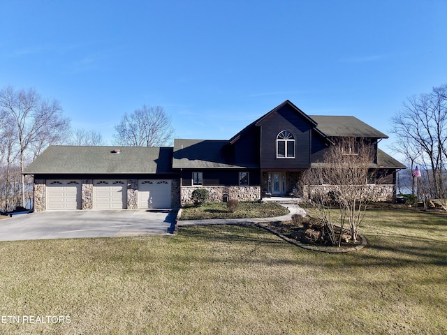 view of front of house with a garage, stone siding, concrete driveway, and a front yard