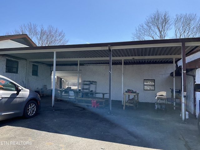 view of parking with an attached carport