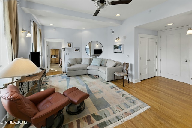 living room featuring recessed lighting, light wood-type flooring, visible vents, and ceiling fan