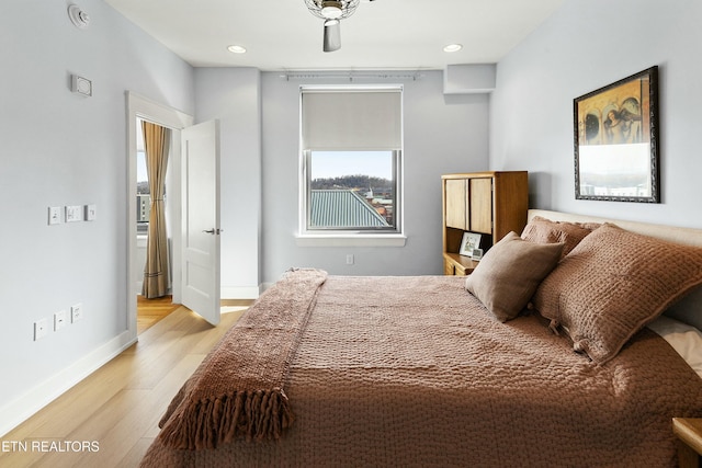 bedroom featuring recessed lighting, baseboards, and light wood finished floors