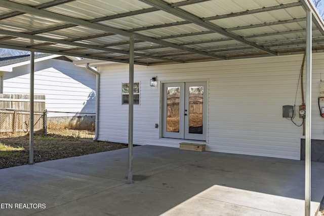 exterior space with french doors and fence