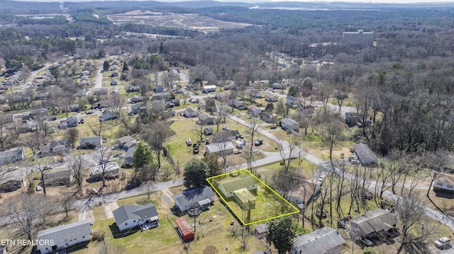 aerial view featuring a residential view and a view of trees