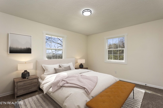 bedroom featuring carpet floors, multiple windows, and baseboards