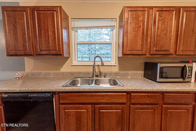 kitchen featuring black dishwasher, stainless steel microwave, a sink, and brown cabinets