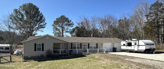 view of front of home with driveway, crawl space, an attached garage, fence, and a front lawn