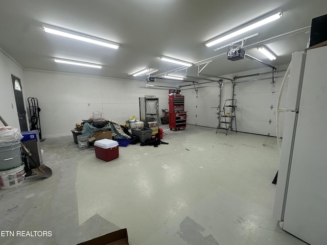 362 Valley View Rd, Lafollette, TN 37766 - garage featuring freestanding refrigerator and a garage door opener