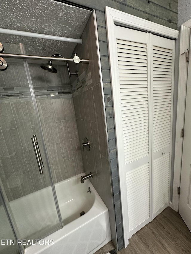362 Valley View Rd, Lafollette, TN 37766 - full bathroom featuring shower / bath combination with glass door, a closet, and wood finished floors