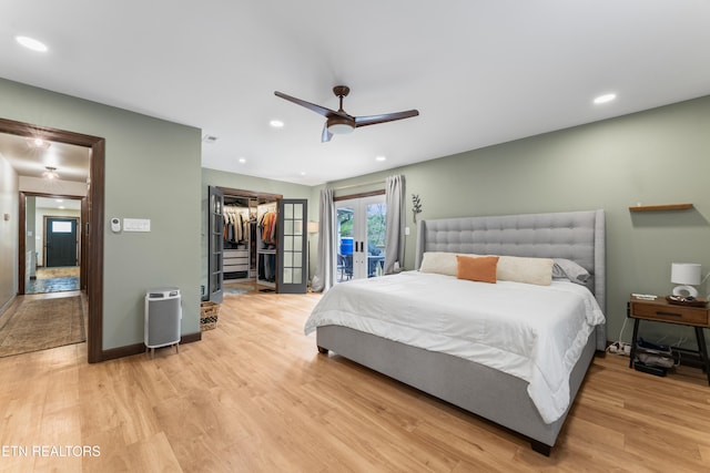 bedroom featuring light wood-type flooring, access to exterior, recessed lighting, and french doors