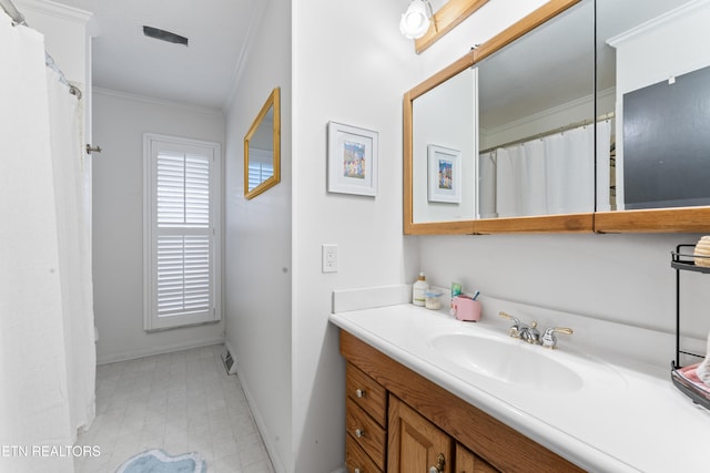 full bath featuring baseboards, ornamental molding, and vanity