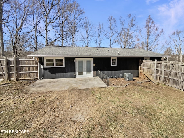 rear view of house featuring a patio, french doors, and fence