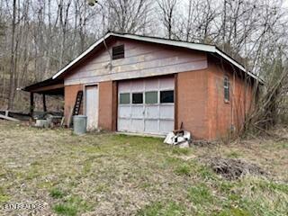 detached garage featuring driveway