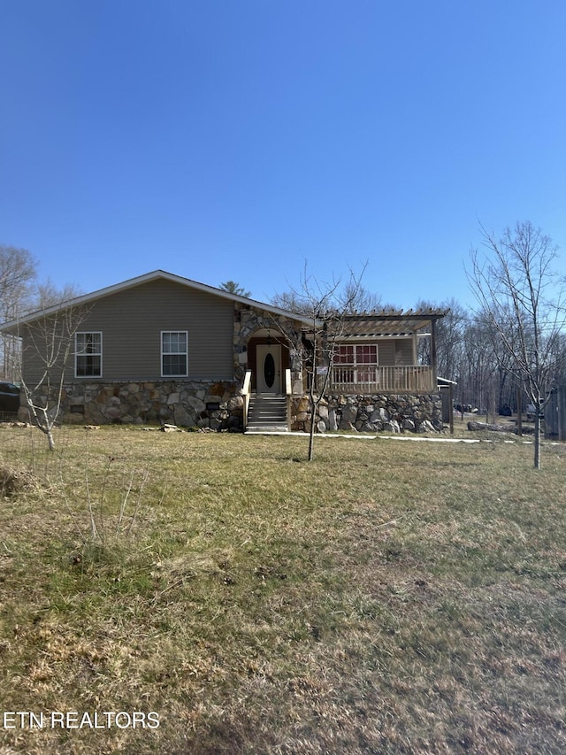 ranch-style house with a front lawn