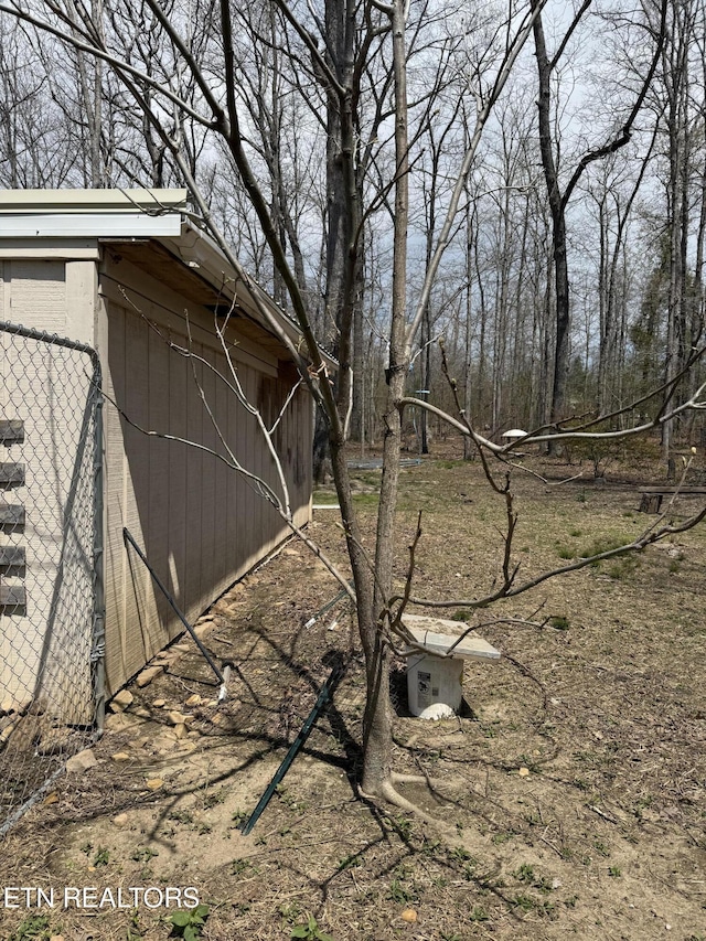 view of property exterior with fence