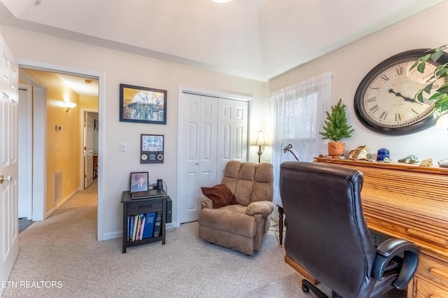 carpeted office featuring baseboards and visible vents