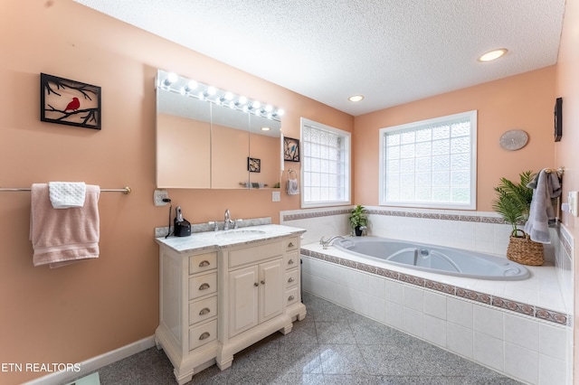 full bath with baseboards, a textured ceiling, granite finish floor, a bath, and recessed lighting