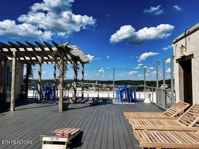 wooden terrace with a pergola