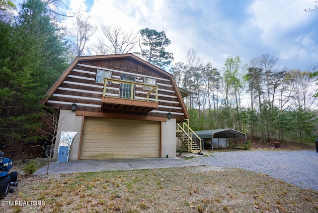 1435 Old Chisholm Trl, Dandridge, TN 37725 - view of front of property with gravel driveway, a gambrel roof, and a carport