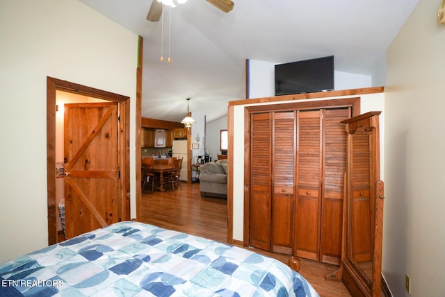 1435 Old Chisholm Trl, Dandridge, TN 37725 - bedroom with freestanding refrigerator, lofted ceiling, wood finished floors, a closet, and a ceiling fan