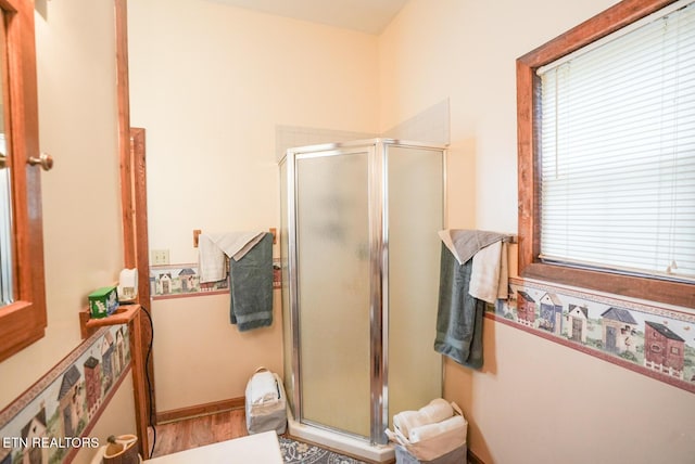 1435 Old Chisholm Trl, Dandridge, TN 37725 - full bath featuring a stall shower and wood finished floors