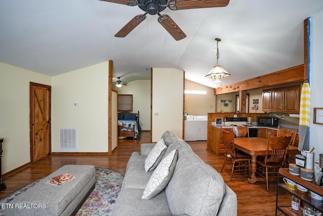 1435 Old Chisholm Trl, Dandridge, TN 37725 - living room with a ceiling fan, separate washer and dryer, vaulted ceiling, wood finished floors, and baseboards
