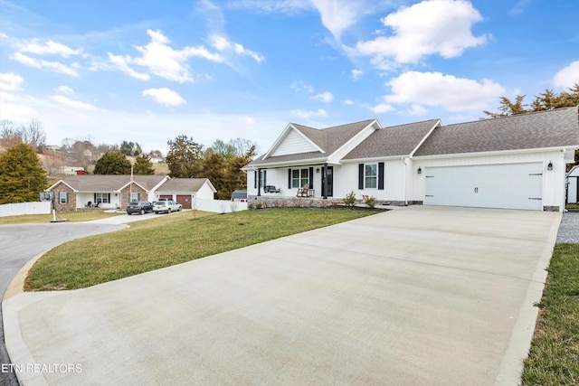 ranch-style house featuring a front yard, fence, a shingled roof, concrete driveway, and a garage