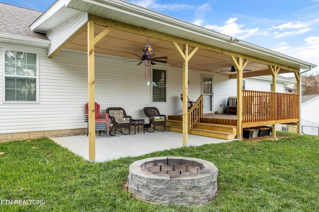 view of patio / terrace with a fire pit and ceiling fan