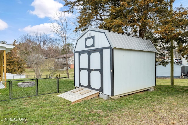 view of shed with a gate and fence