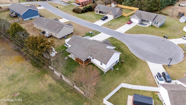 birds eye view of property with a residential view