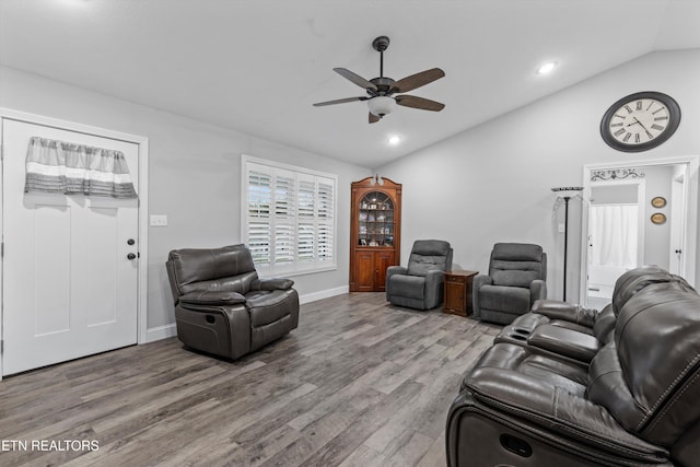 living area featuring recessed lighting, a ceiling fan, lofted ceiling, and wood finished floors