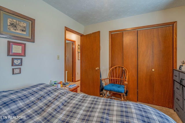 bedroom featuring a closet and a textured ceiling