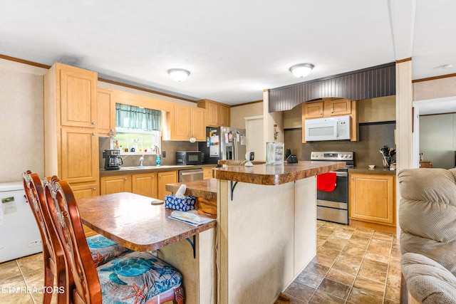 344 Johnson Farm Rd, Maynardville, TN 37807 - kitchen featuring crown molding, dark countertops, appliances with stainless steel finishes, stone finish flooring, and tasteful backsplash