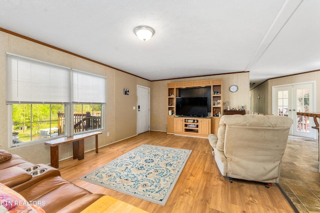 344 Johnson Farm Rd, Maynardville, TN 37807 - living room featuring crown molding, french doors, and light wood-type flooring