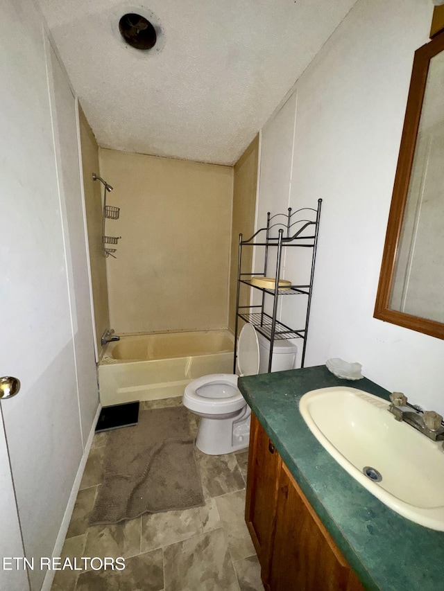 bathroom featuring  shower combination, a textured ceiling, toilet, and vanity