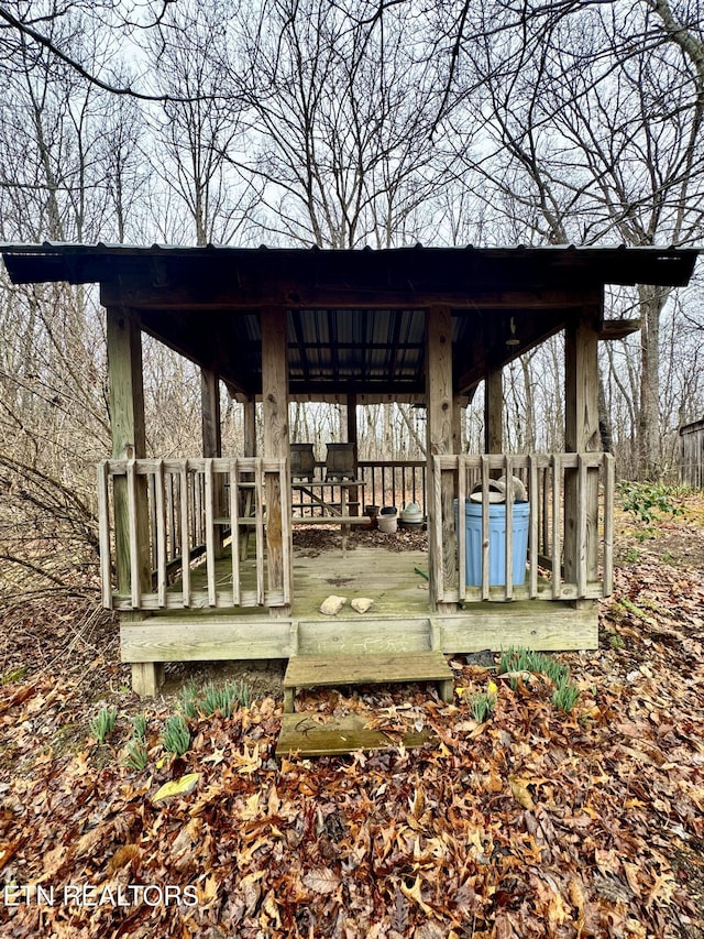 wooden terrace with a gazebo