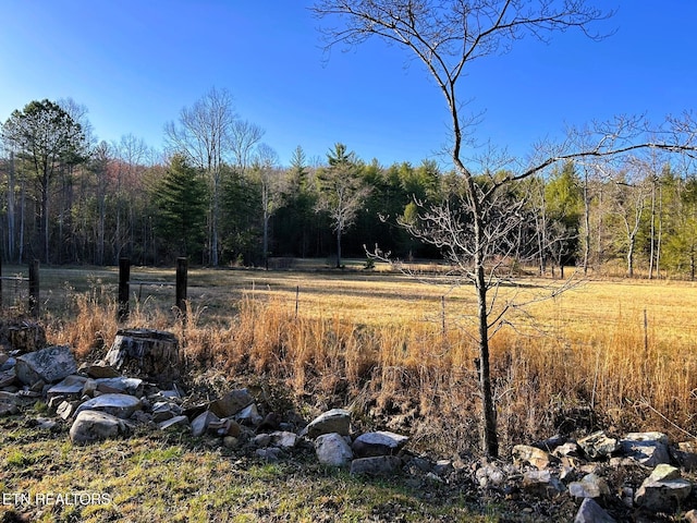 view of landscape featuring a wooded view